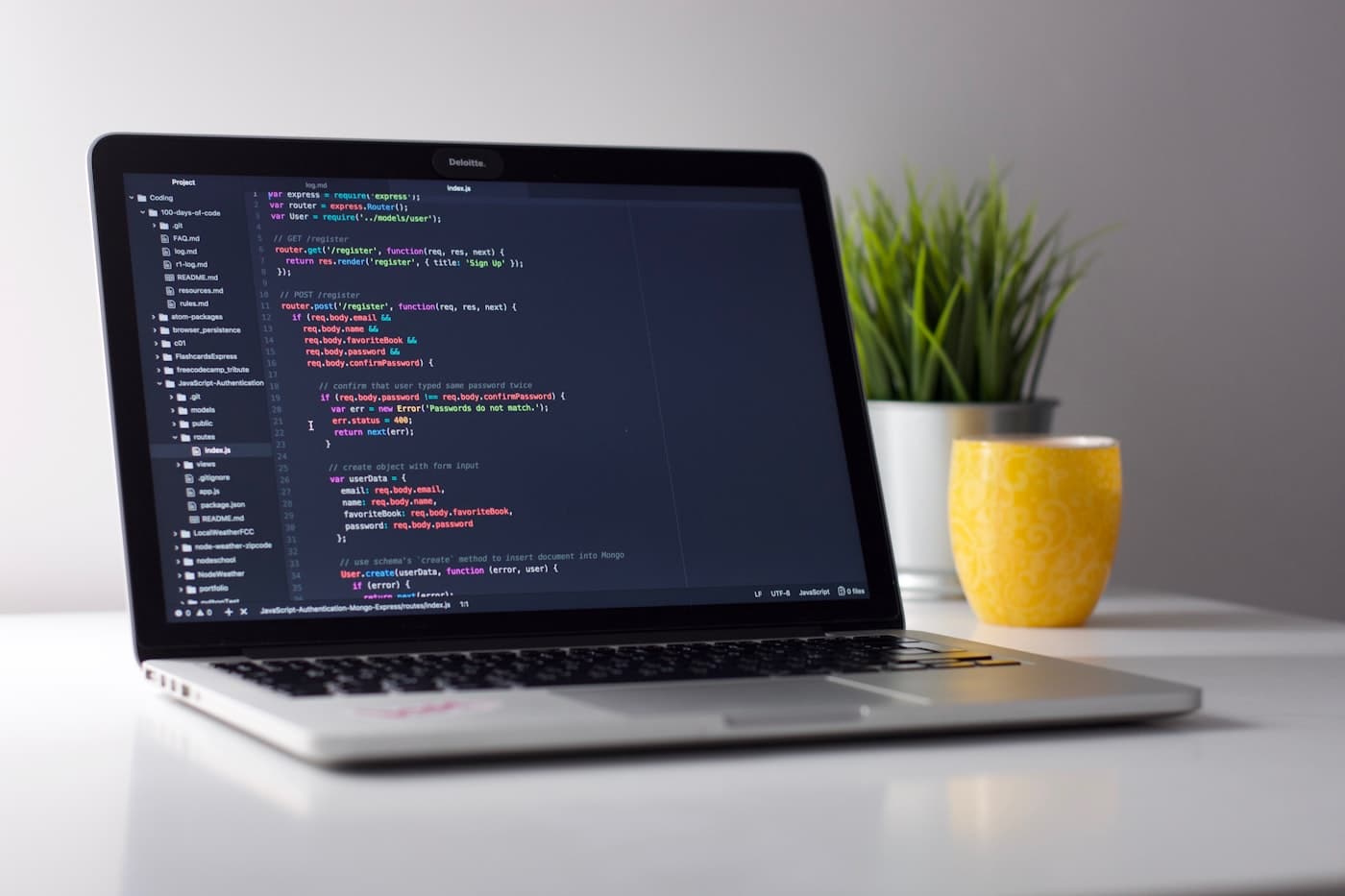 Laptop with code on screen for the Spring Boot article